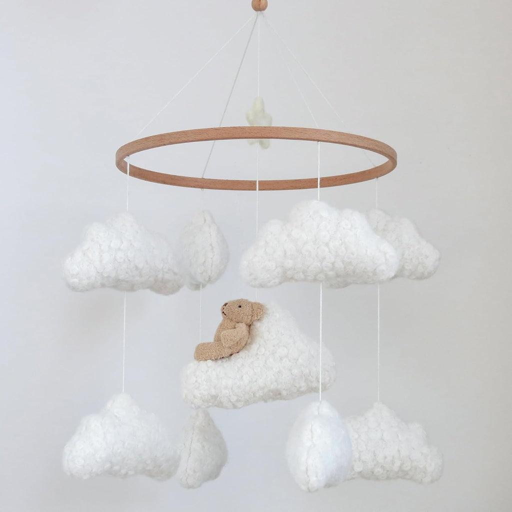Wooden cloud and bear crib mobile in neutral colors